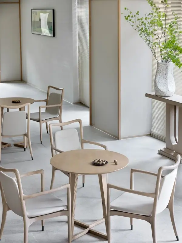 Ivory Round Dining Table with Slender Lines